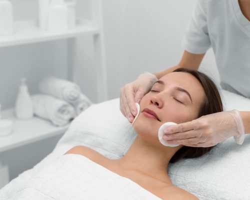 beautician-with-female-client-salon-face-care-routine